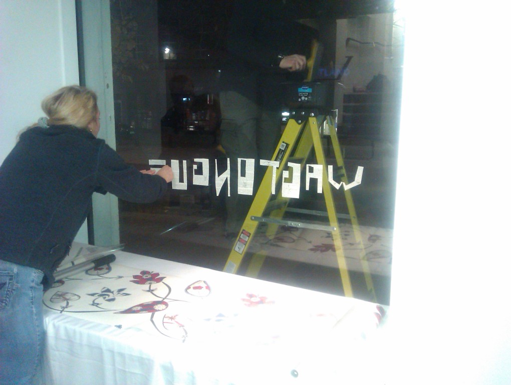 preparing the sign for the window